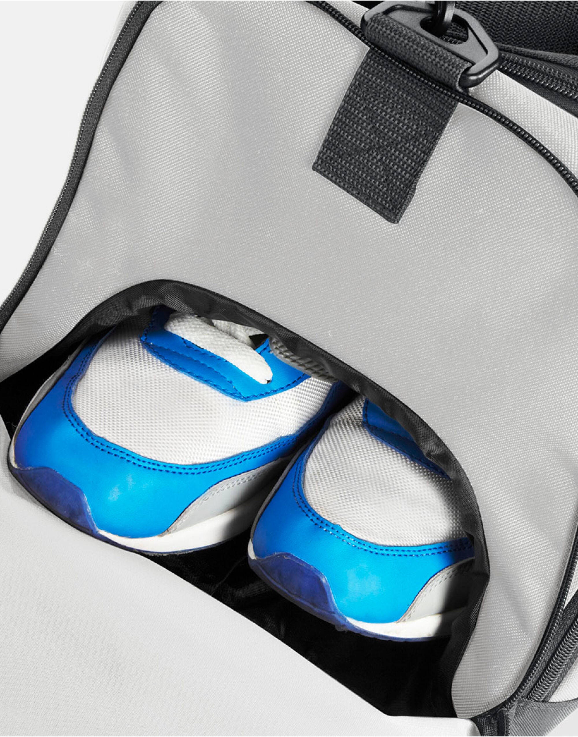 Side view of the heather grey Bagbase Athleisure Holdall, showing the branded zipper pulls.