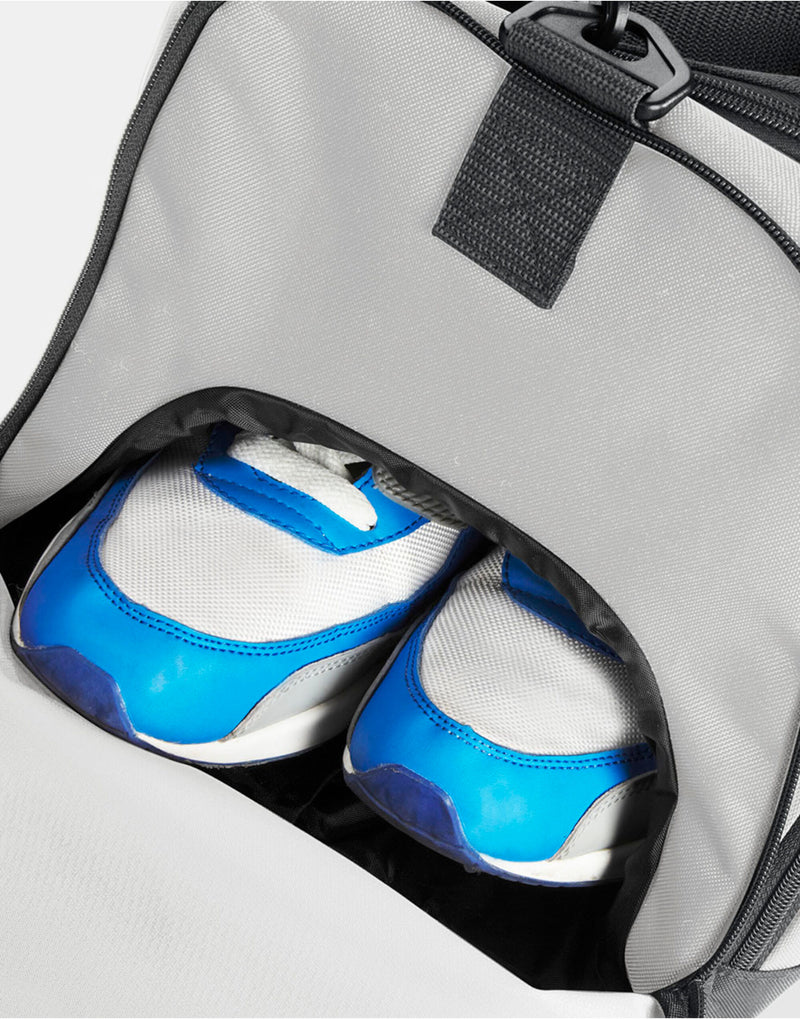 Side view of the heather grey Bagbase Athleisure Holdall, showing the branded zipper pulls.
