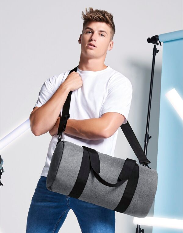 Person wearing the small grey mini essential backpack.