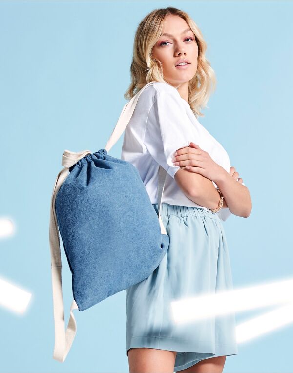 Angled view of the black denim Bagbase Gymsac, showcasing its stylish and casual look.