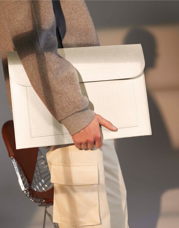 Angled view of the light grey marl Bagbase Felt Laptop Slip, highlighting its protective, minimalist design.