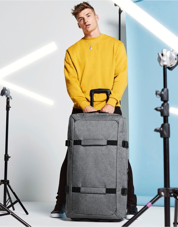 Angled perspective of the Bagbase Escape Check-In Wheelie, showing its large capacity and durable wheels.