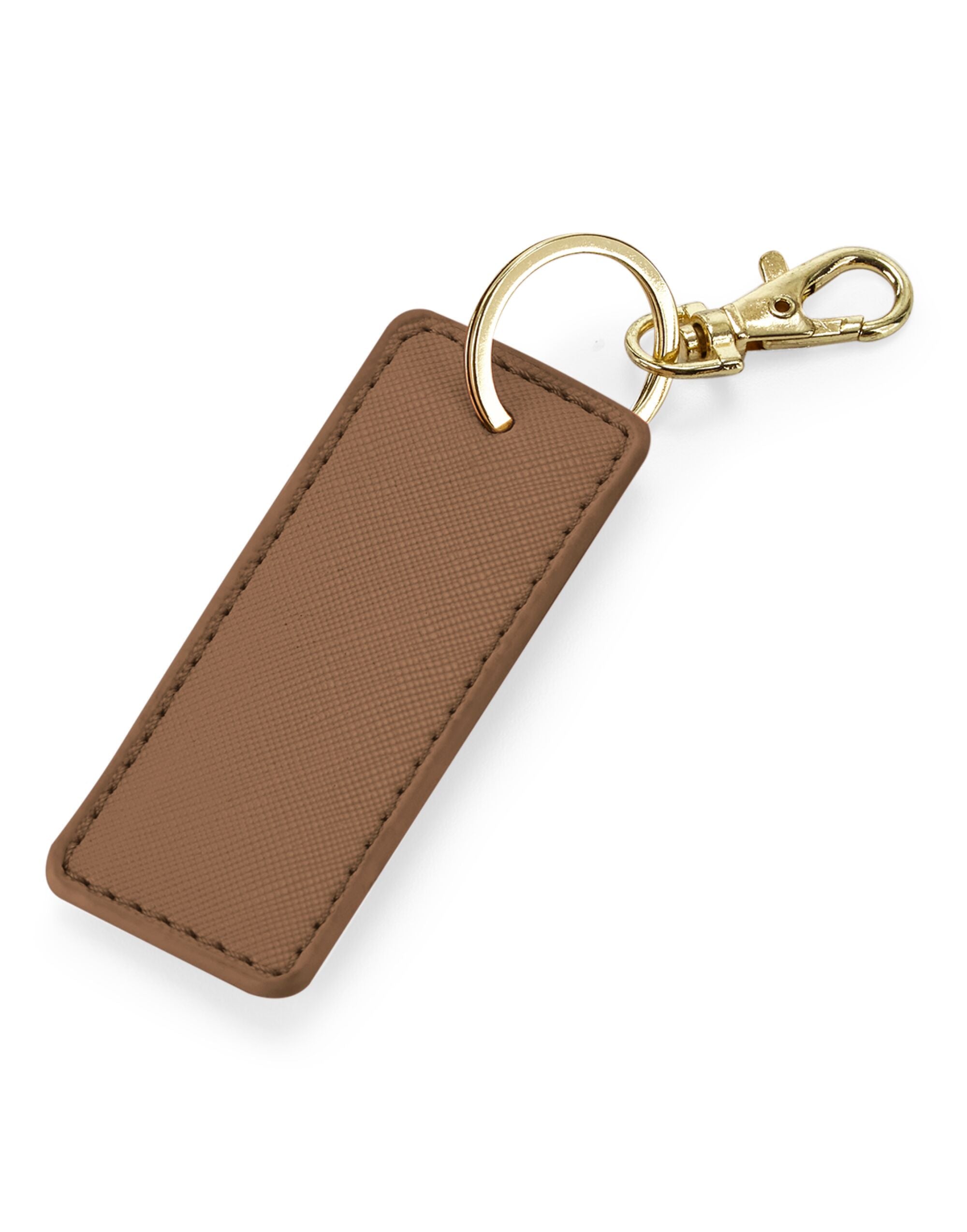 The white Boutique Key Clip attached to a handbag, demonstrating its use.