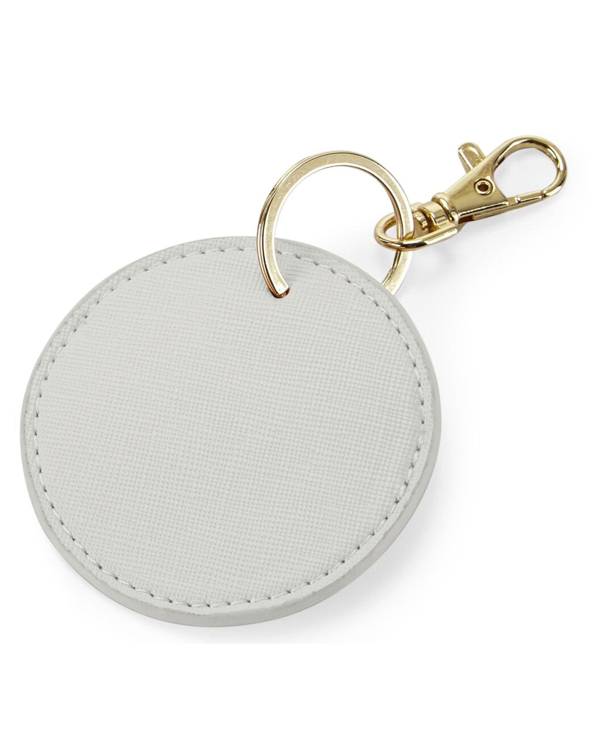 The white circular key clip, shown hanging from its gold clip.