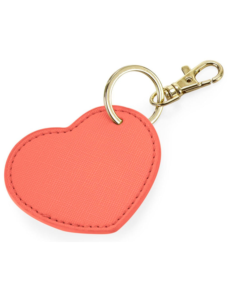 The white Boutique Heart Key Clip, an adorable and stylish accessory for keys or bags.