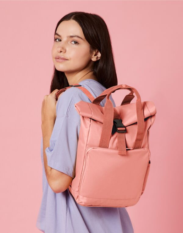 Angled shot of a fuchsia junior fashion backpack.