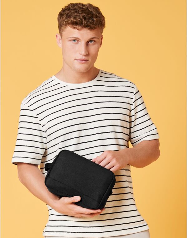 A monochrome geometric patterned adjustable bag strap.