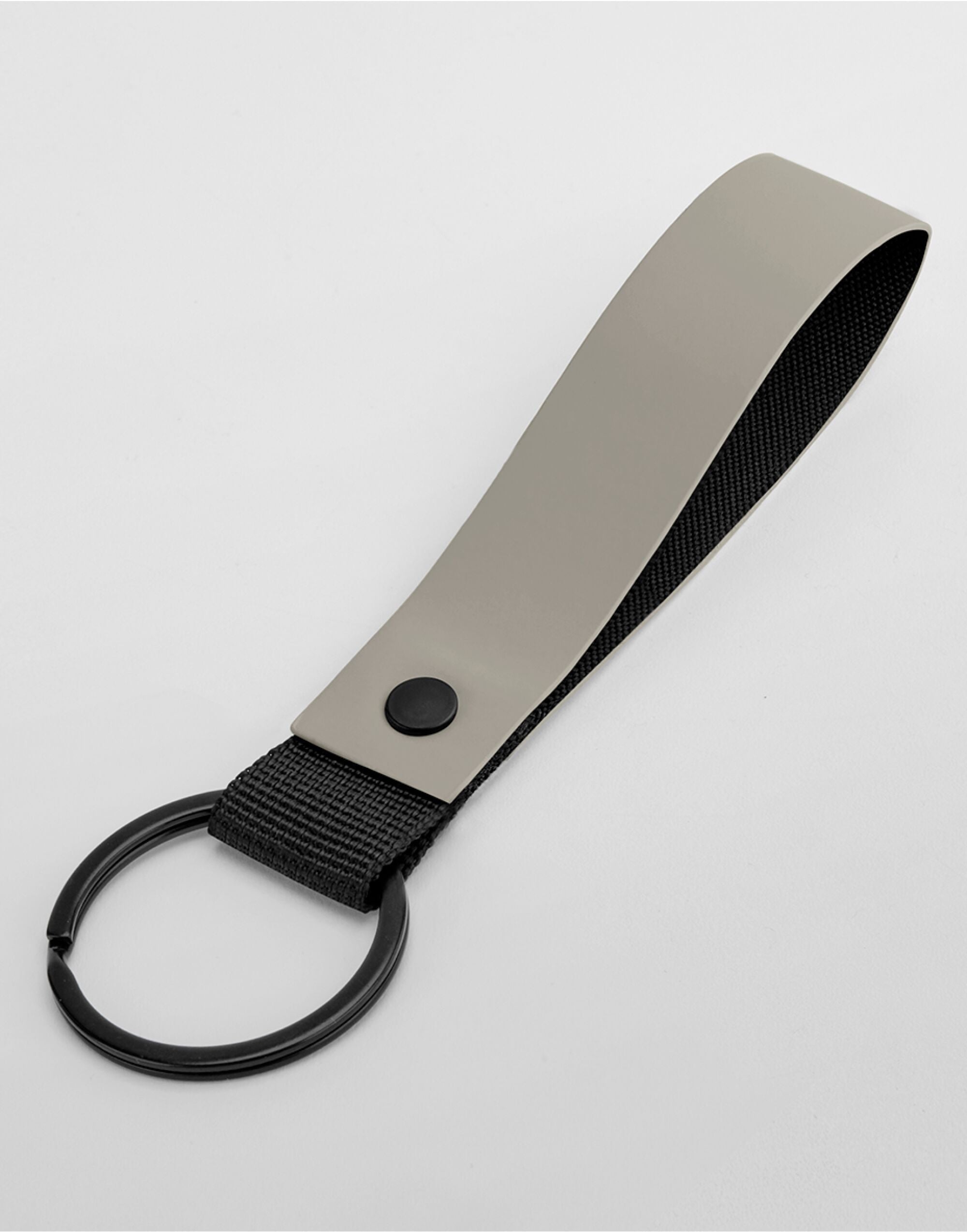 Close-up detail of the gold clip on the grey matte PU keyring.