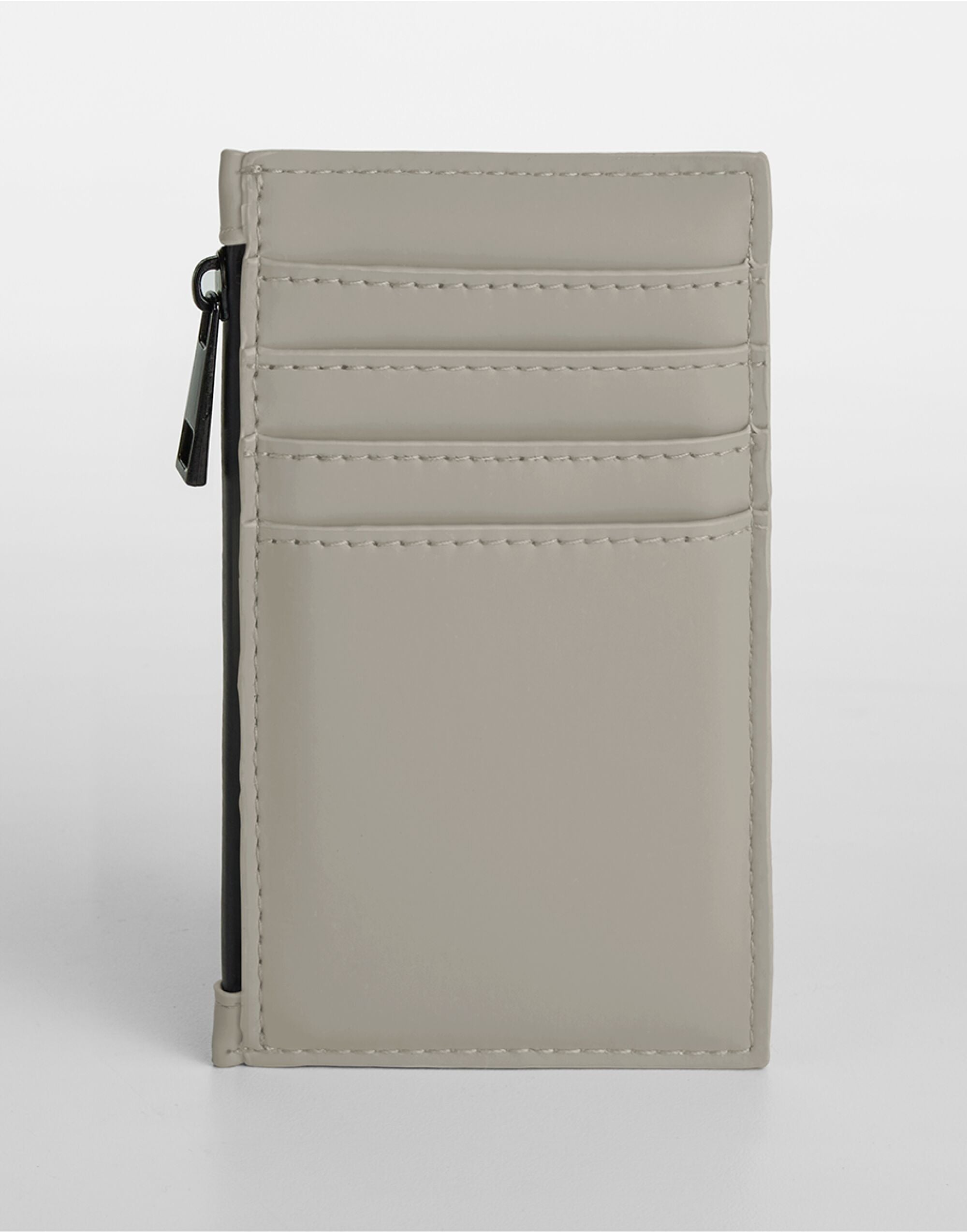 Person holding the grey matte PU card holder.