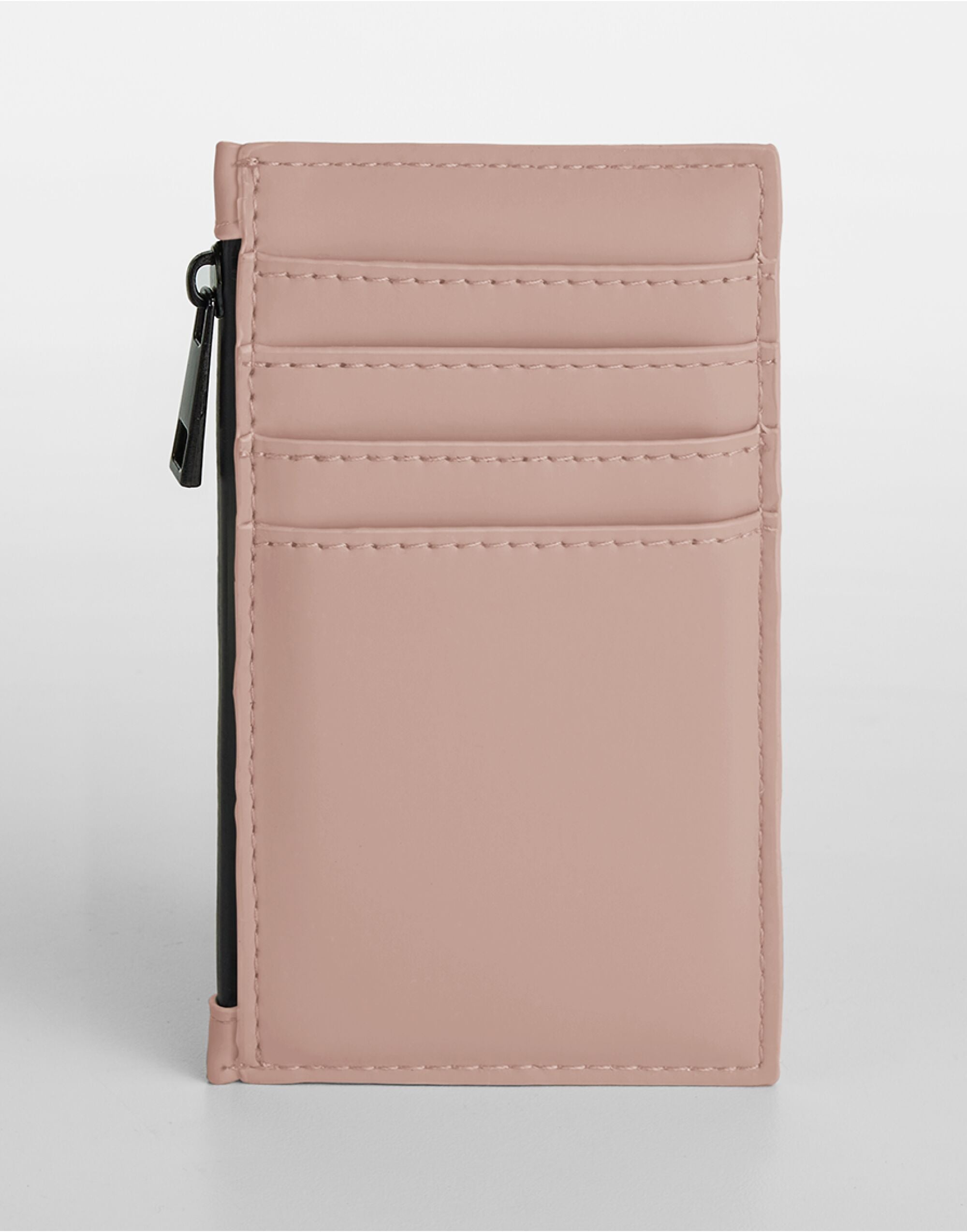 Close-up view of the stitching on the pink card holder.