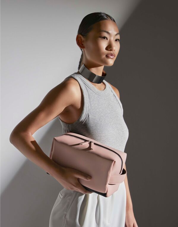 pink matte PU toiletry and accessory case, front view.