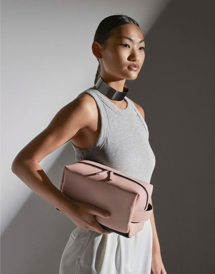 pink matte PU toiletry and accessory case, front view.