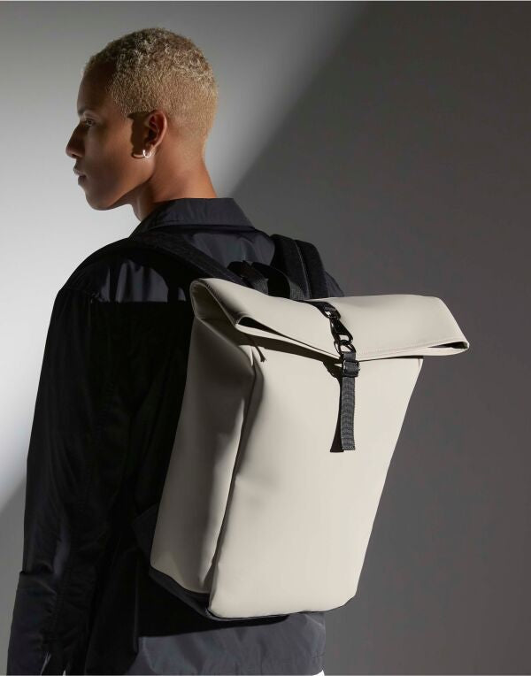 Grey matte PU roll-top backpack with a modern design.