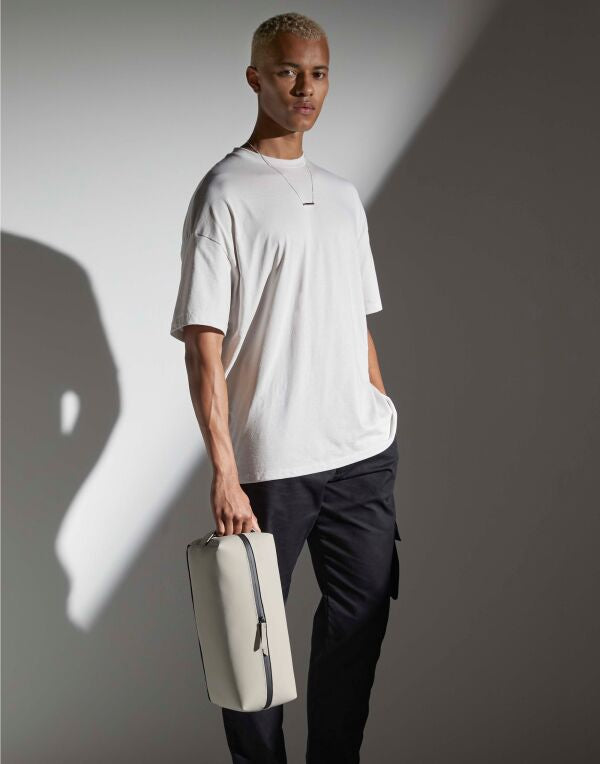Rear view of the soft grey Bagbase boutique waist bag.