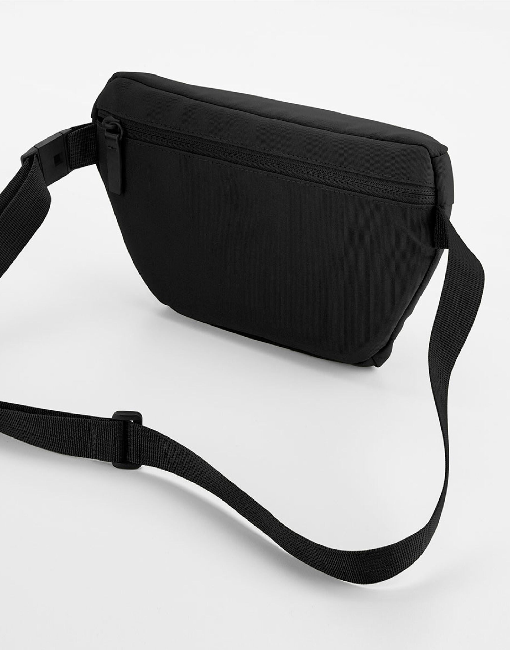 Close-up of the main zippered closure and elegant pull tab on the Bagbase Simplicity Waistpack.