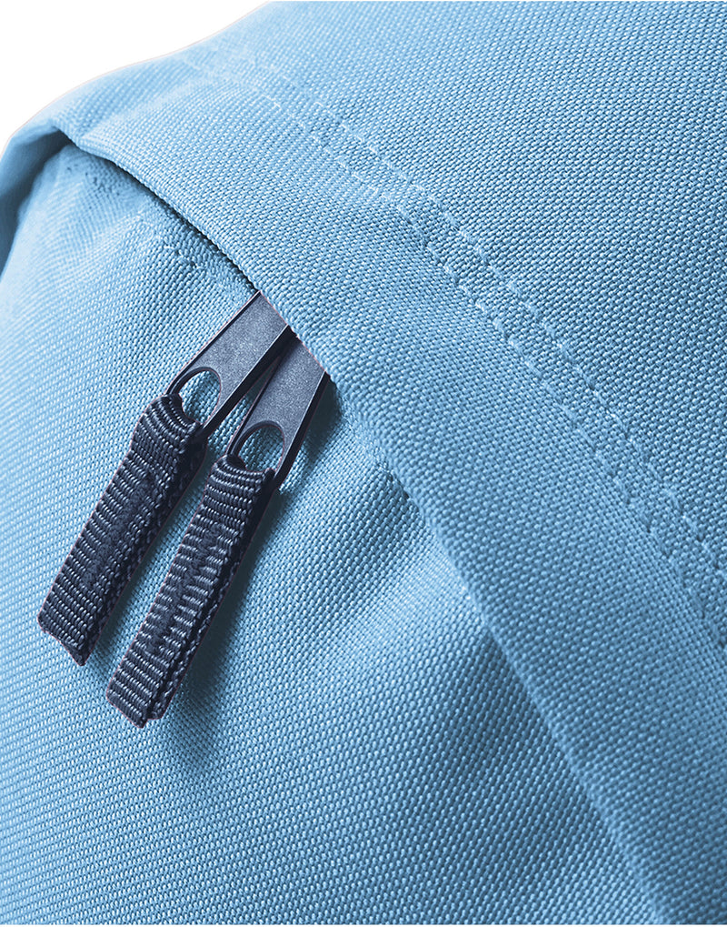 A mint green Mini Barrel Bag laid flat.