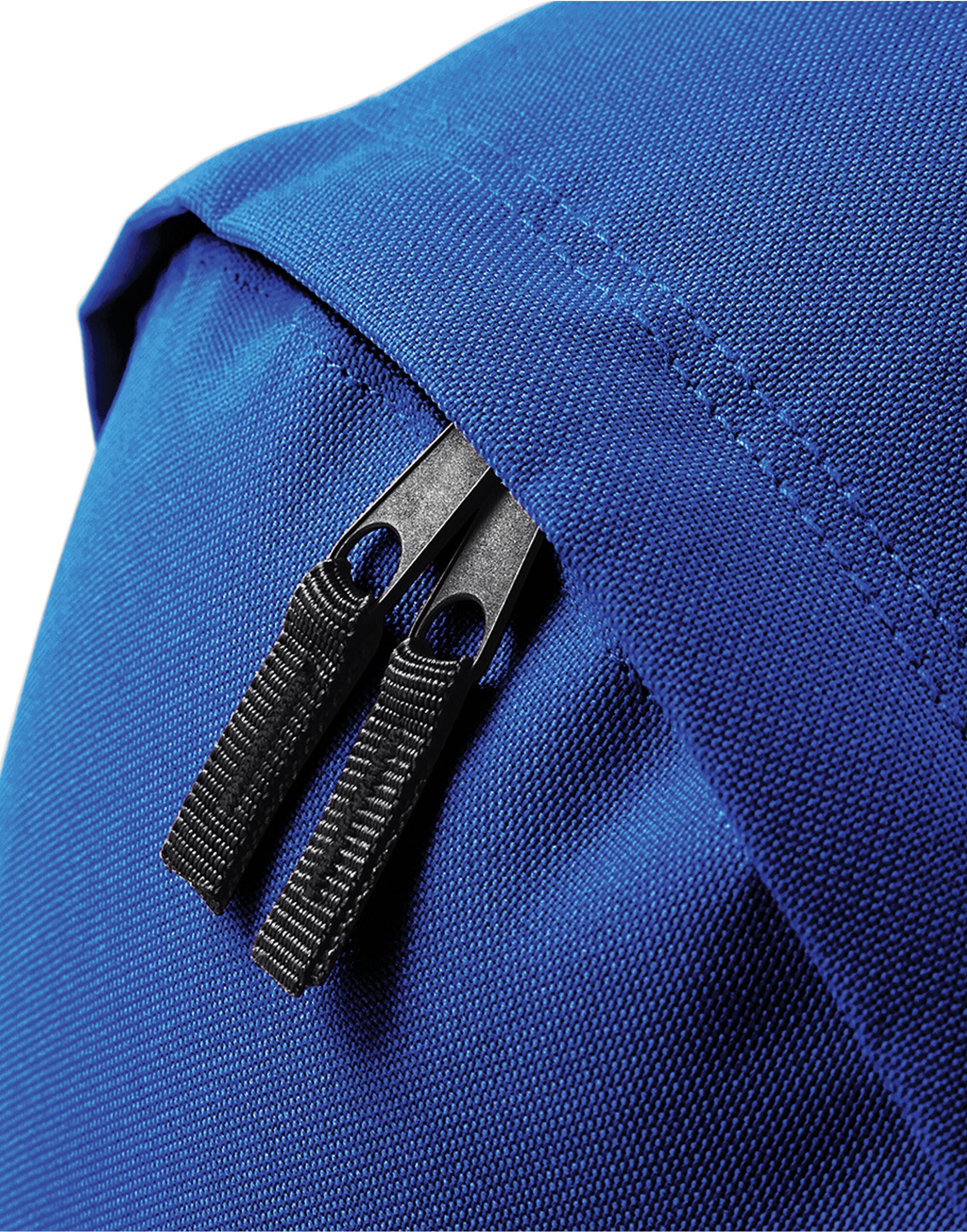Person wearing the blue Bagbase Maxi Fashion Backpack to show its size.