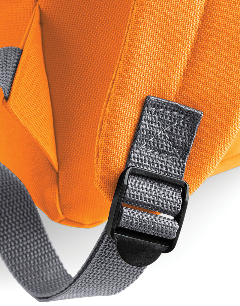 Detail of the main zipper on a black mini backpack.