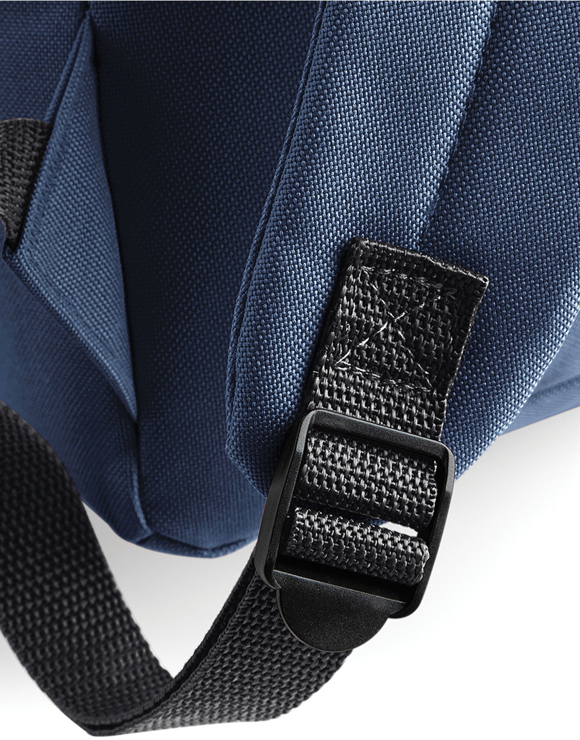 Close-up of the zipper detail on a grey fashion backpack.