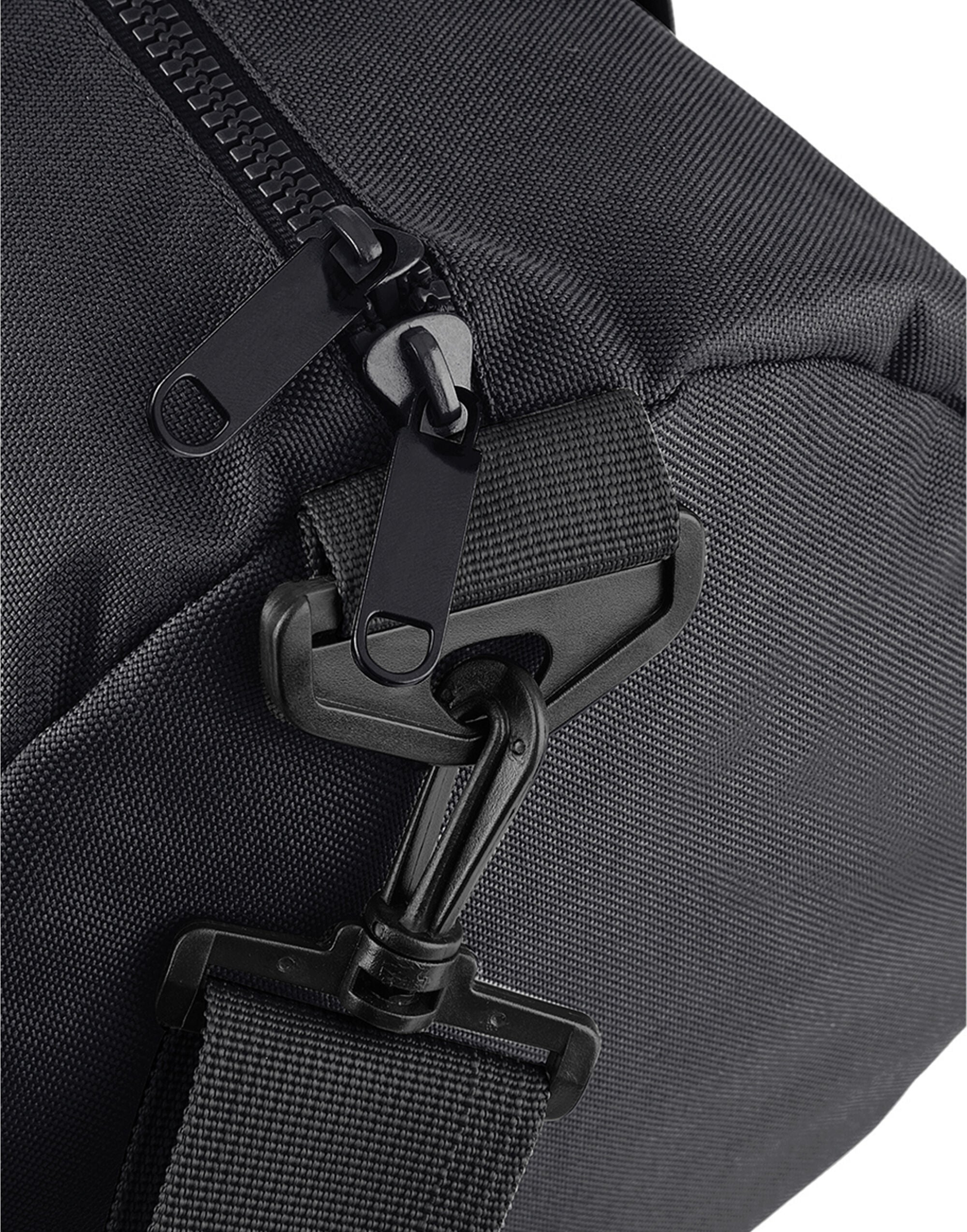 Angled view of a navy mini essential backpack.