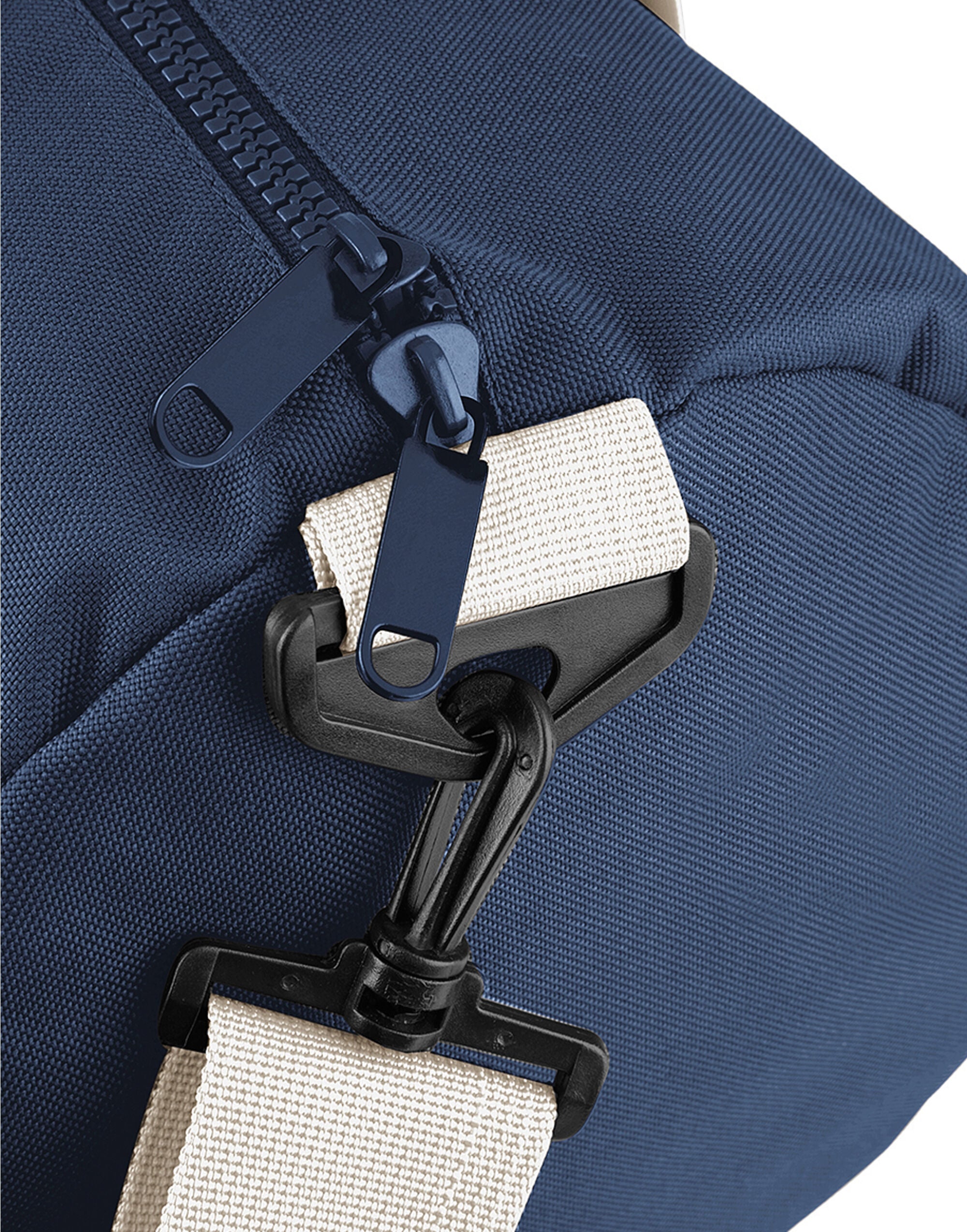 Person attaching the grey Modulr pouch to a compatible backpack.