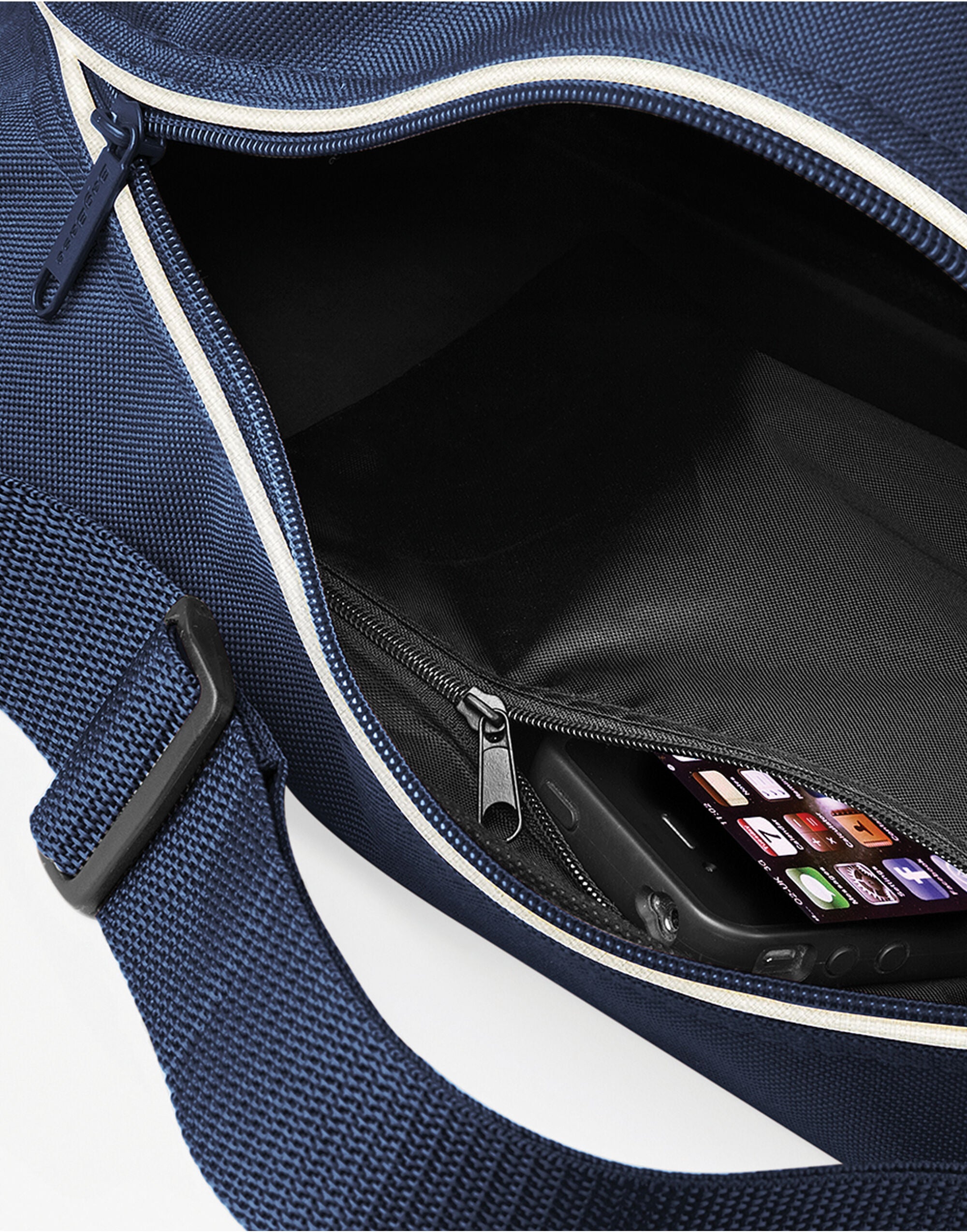 Close-up of the handles and strap clips on a grey holdall.