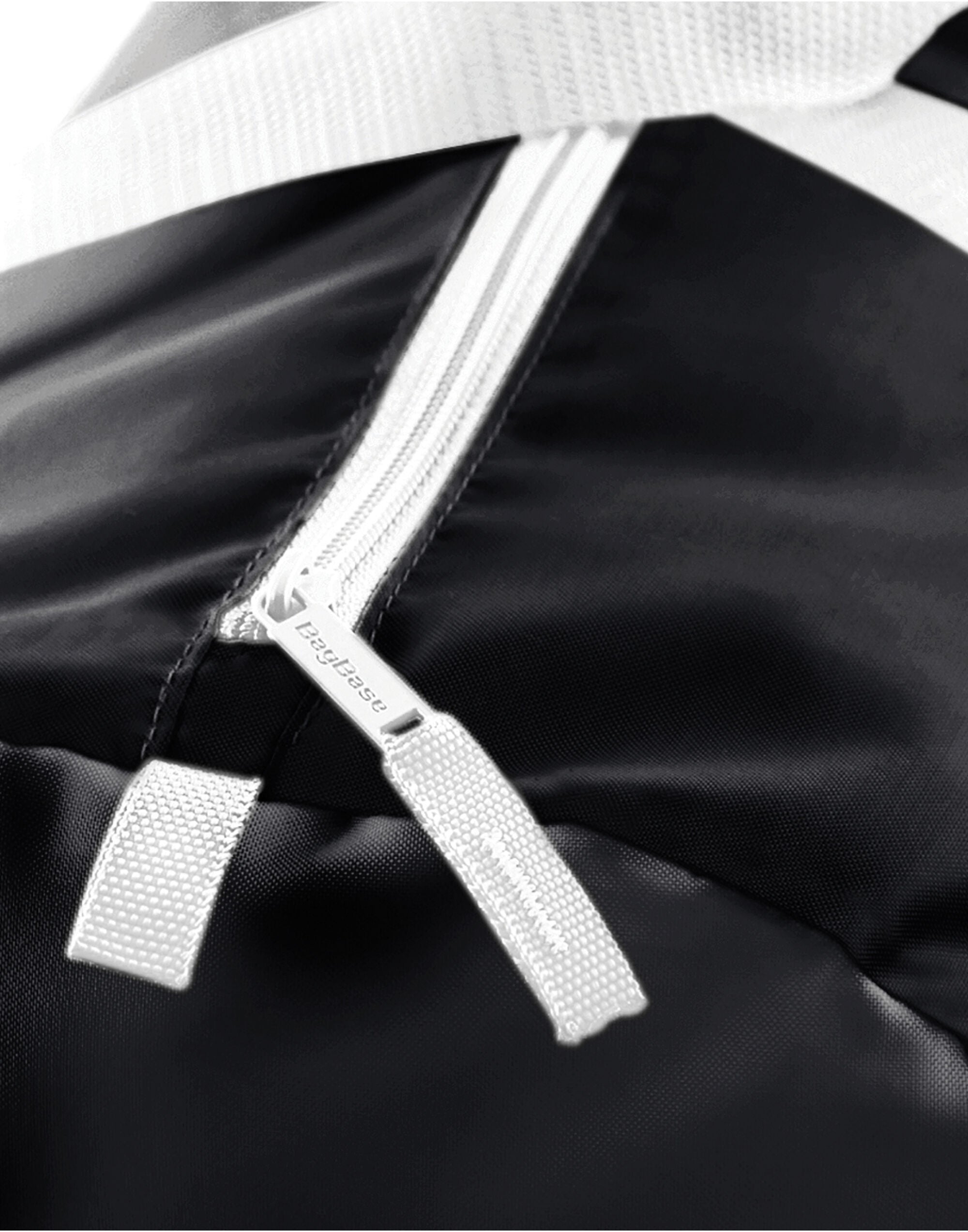 A black Bagbase Recycled Essentials Holdall, front view.