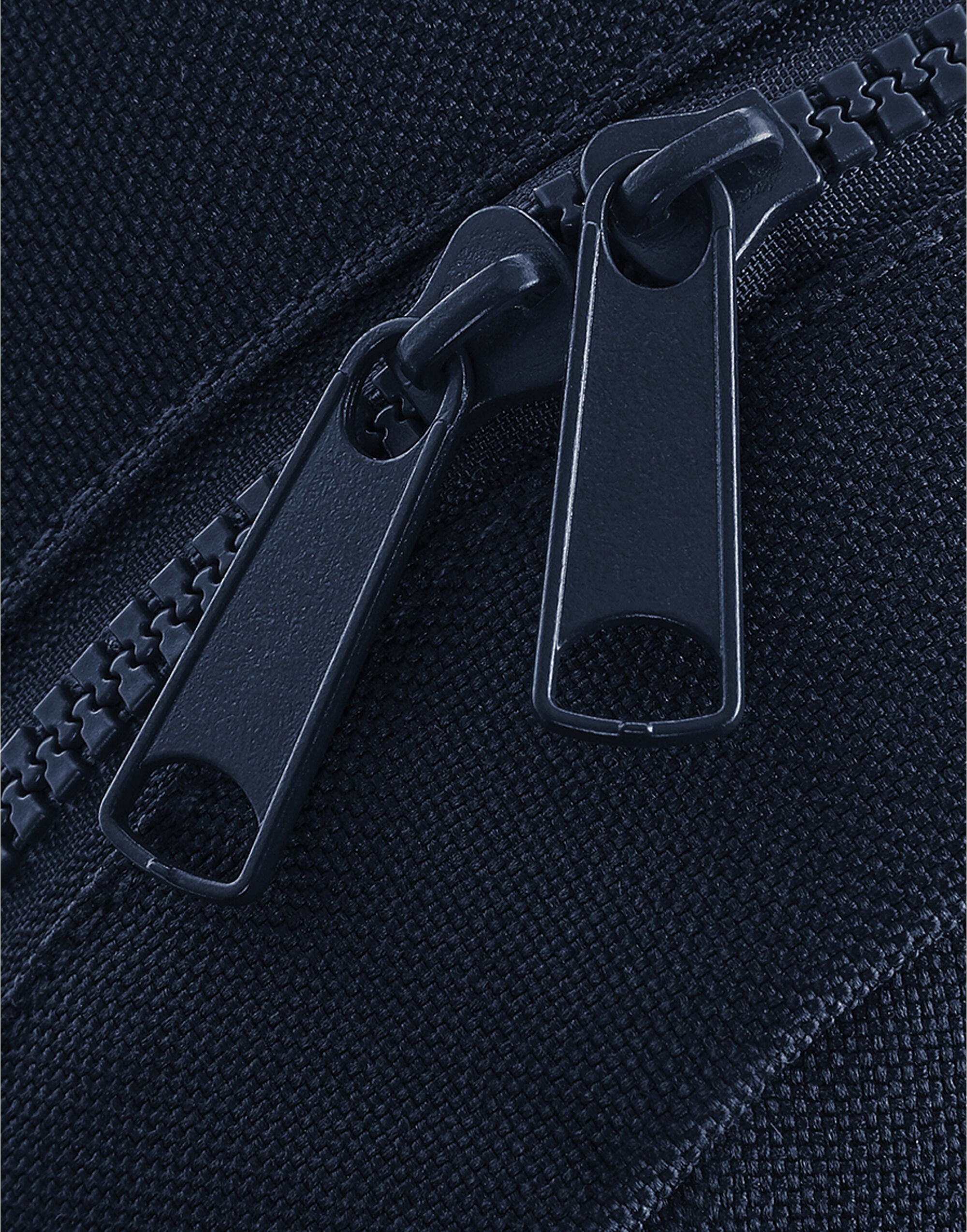 Angled view of the oyster-colored weekender with gold hardware.