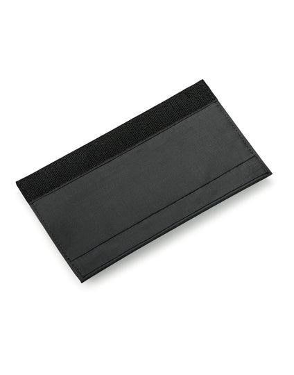 The black Bagbase Escape Handle Wrap, designed to provide a comfortable grip for luggage handles.