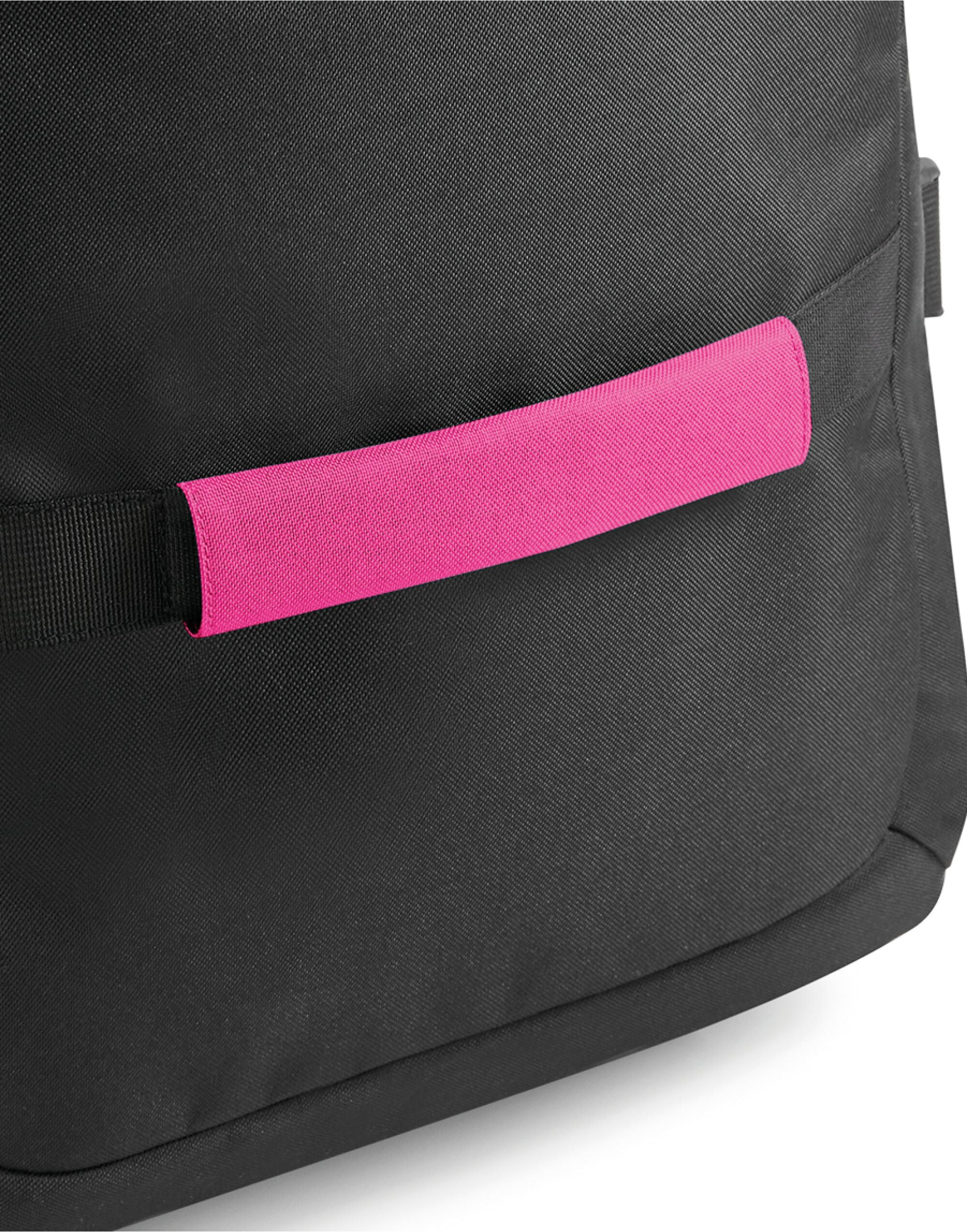 A hand gripping a luggage handle with the Bagbase Escape Handle Wrap for added comfort.