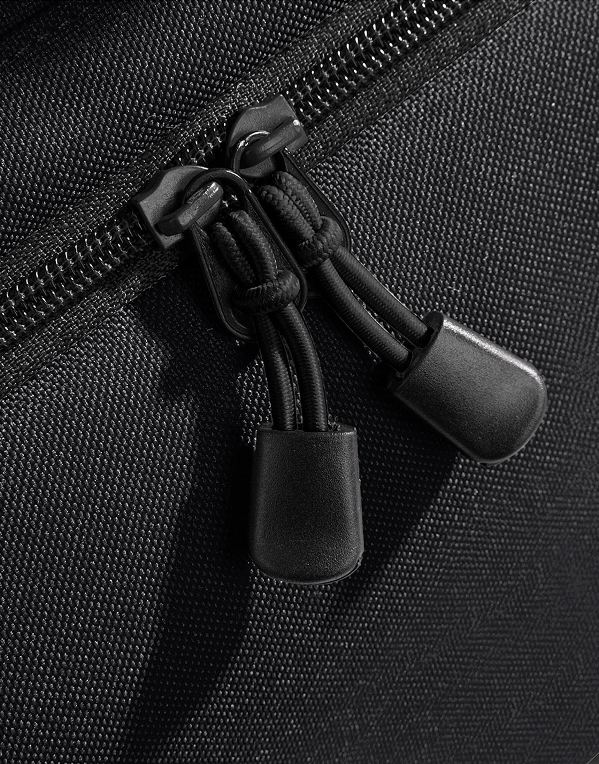 Frontal view of the heather grey Bagbase Athleisure Holdall, showing the front zippered pocket for essentials.