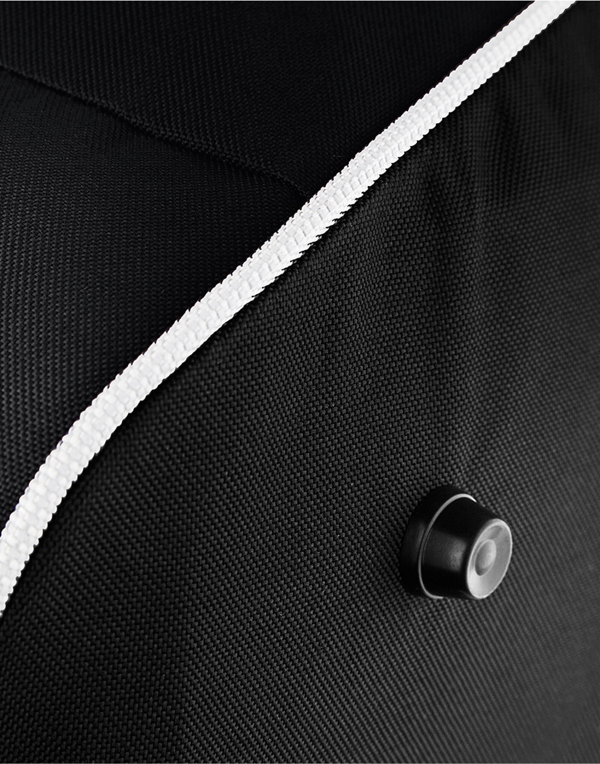 Angled view of the bright red Bagbase Teamwear Holdall, showcasing its spacious main compartment and side pockets.