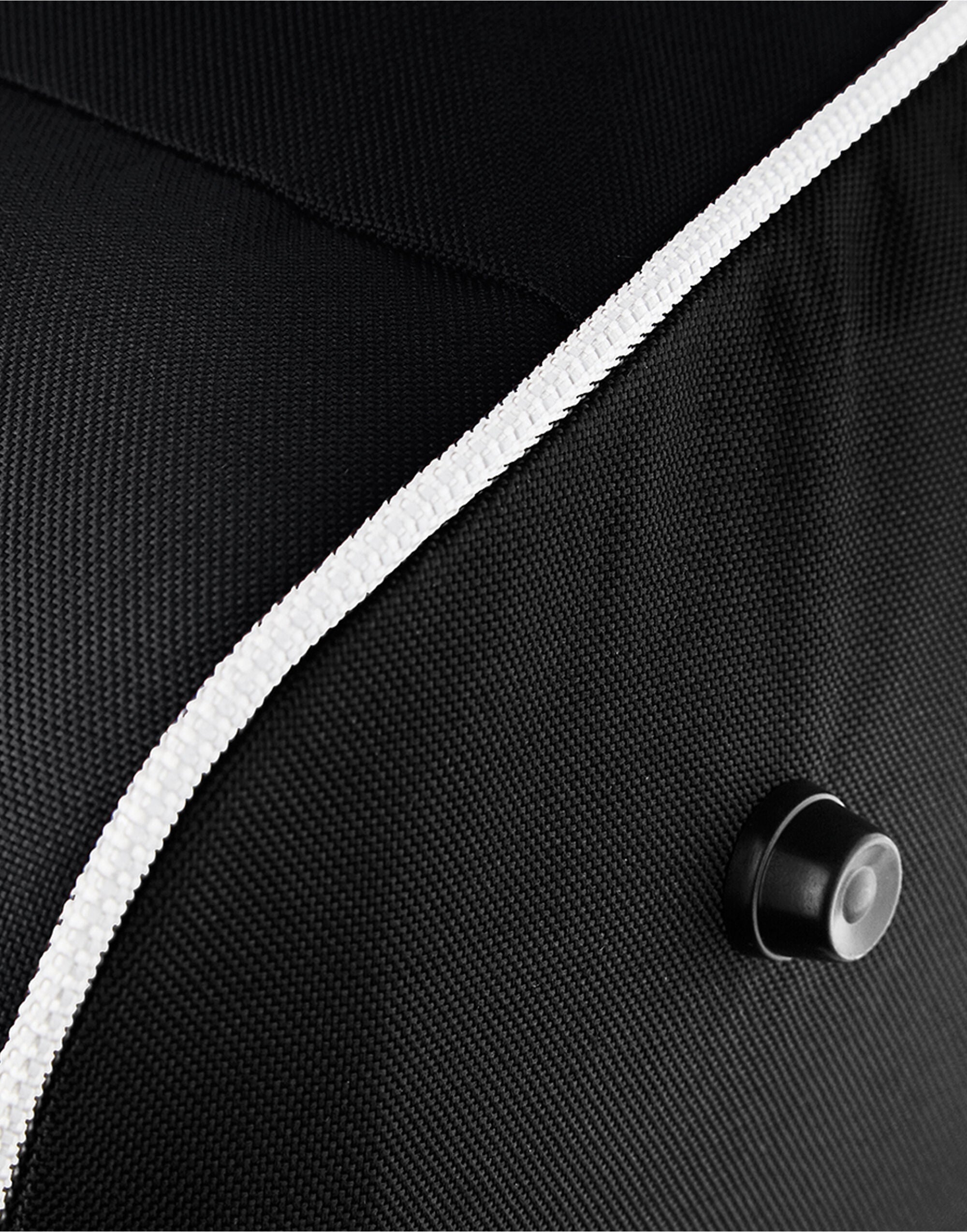 Interior shot of the red Bagbase Teamwear Holdall, revealing its large capacity for equipment and clothing.