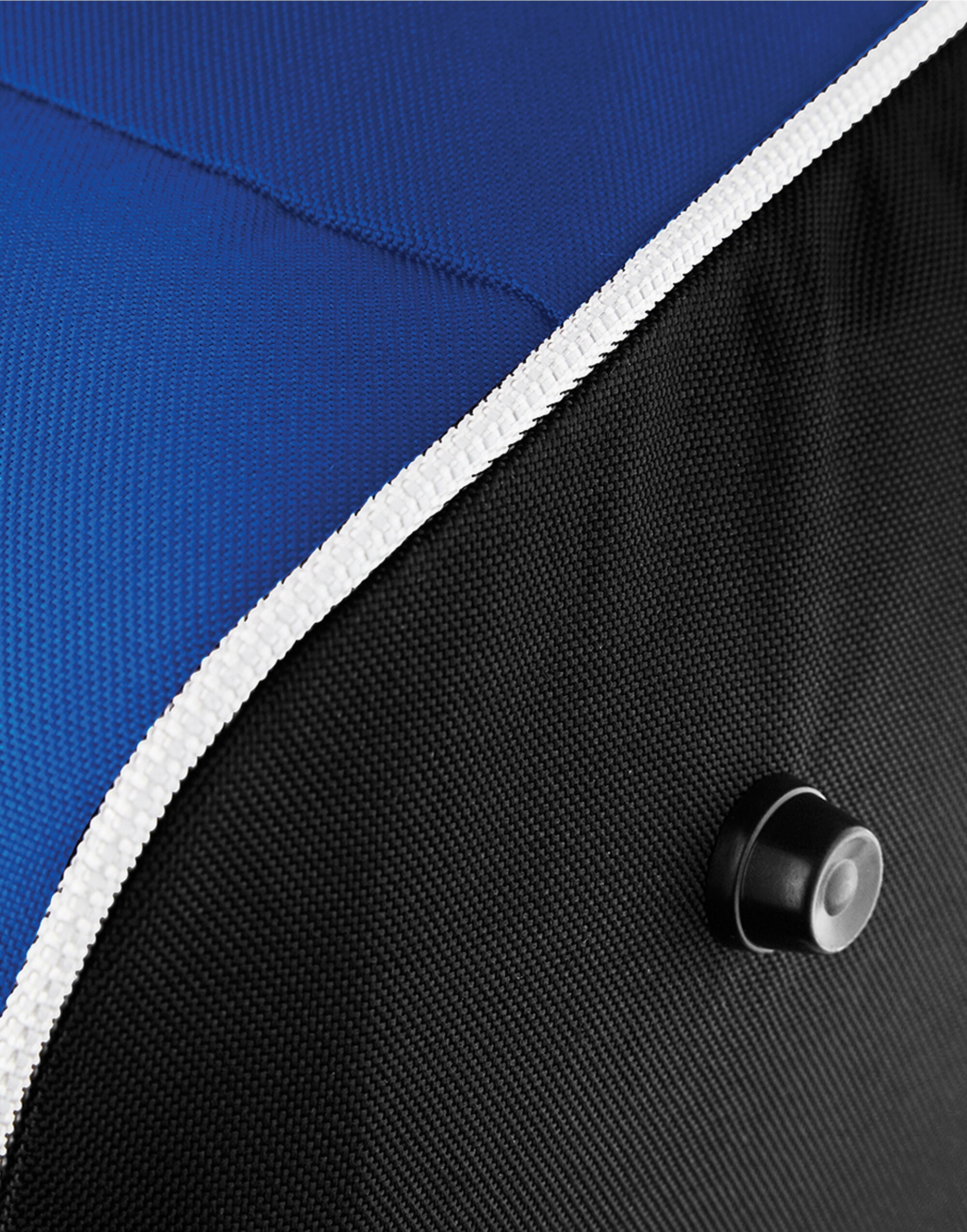 Angled shot of the bright red Bagbase Teamwear Holdall, emphasizing its bold color and functionality.