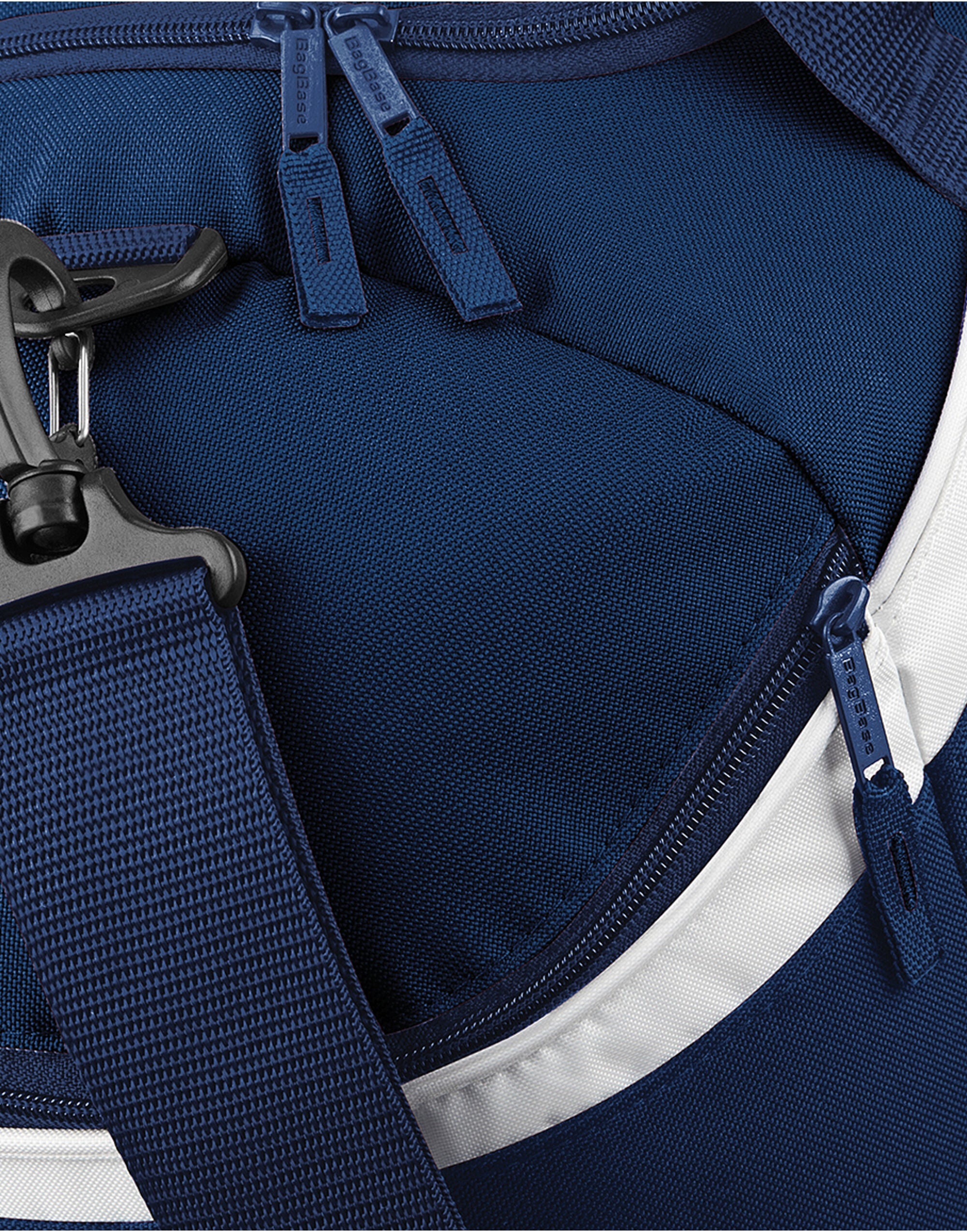 Close-up of the branded zipper pulls on the royal blue Bagbase Teamwear Holdall.