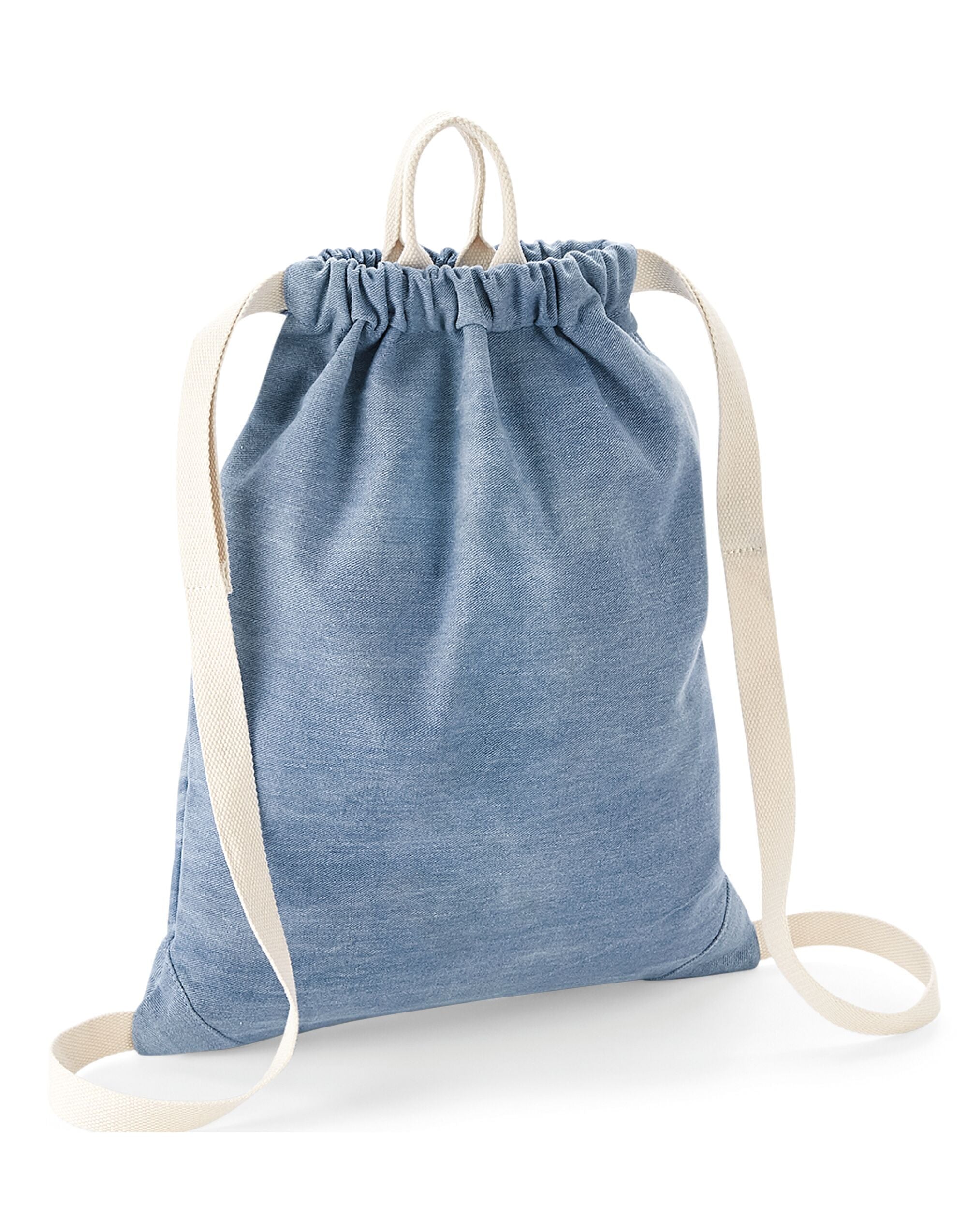 A person wearing the black denim Bagbase Gymsac, demonstrating its practical use and style.