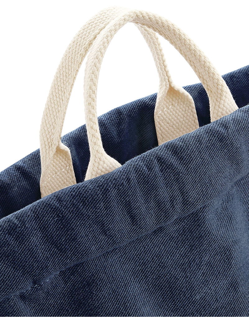Close-up of the high-quality denim fabric and stitching on the Bagbase Denim Gymsac.