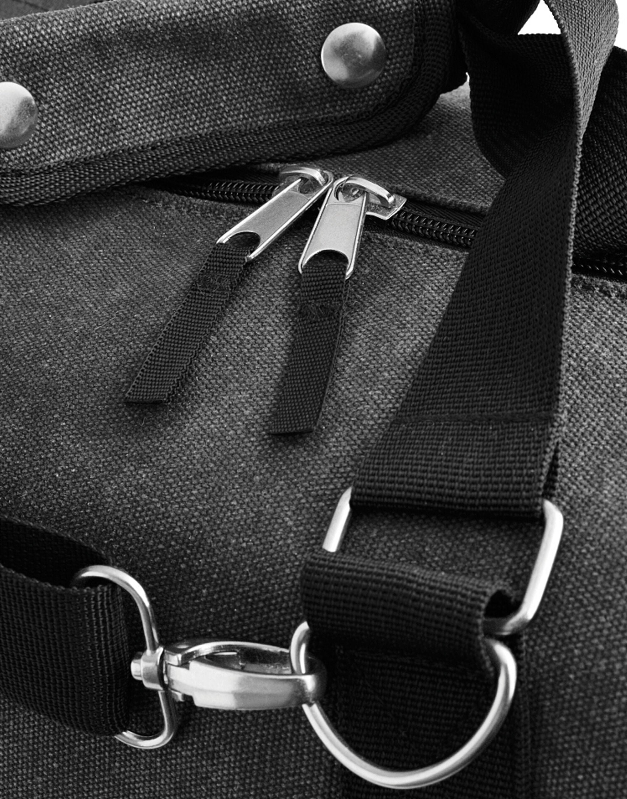 The main zippered compartment of the military green Bagbase Vintage Weekender, showing its roomy interior.