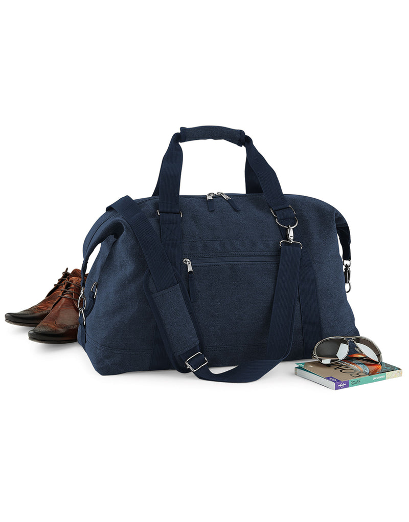 A full frontal shot of the navy Bagbase Vintage Canvas Weekender on a white background.