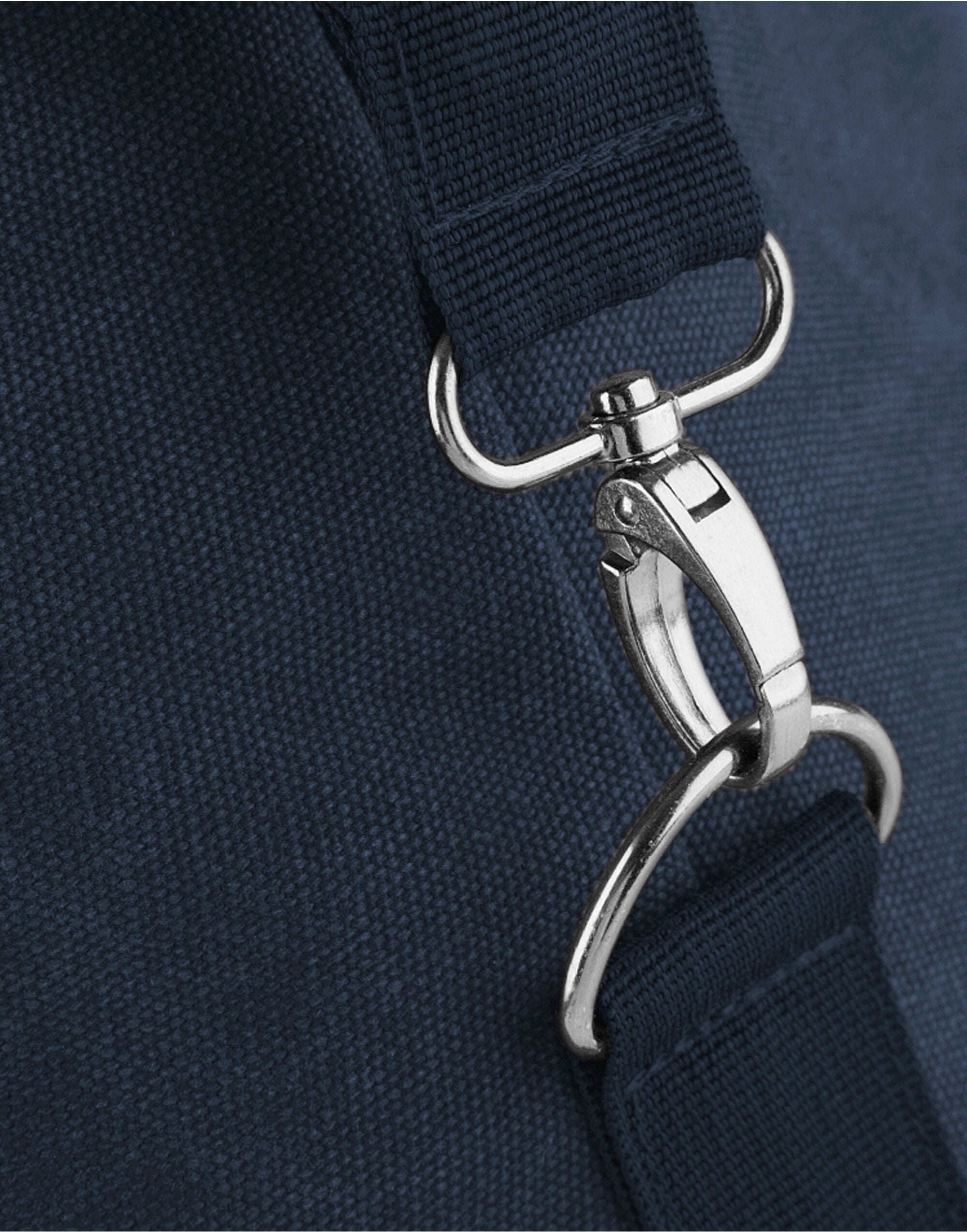 Angled perspective of the black Vintage Canvas Weekender, a timeless travel essential.