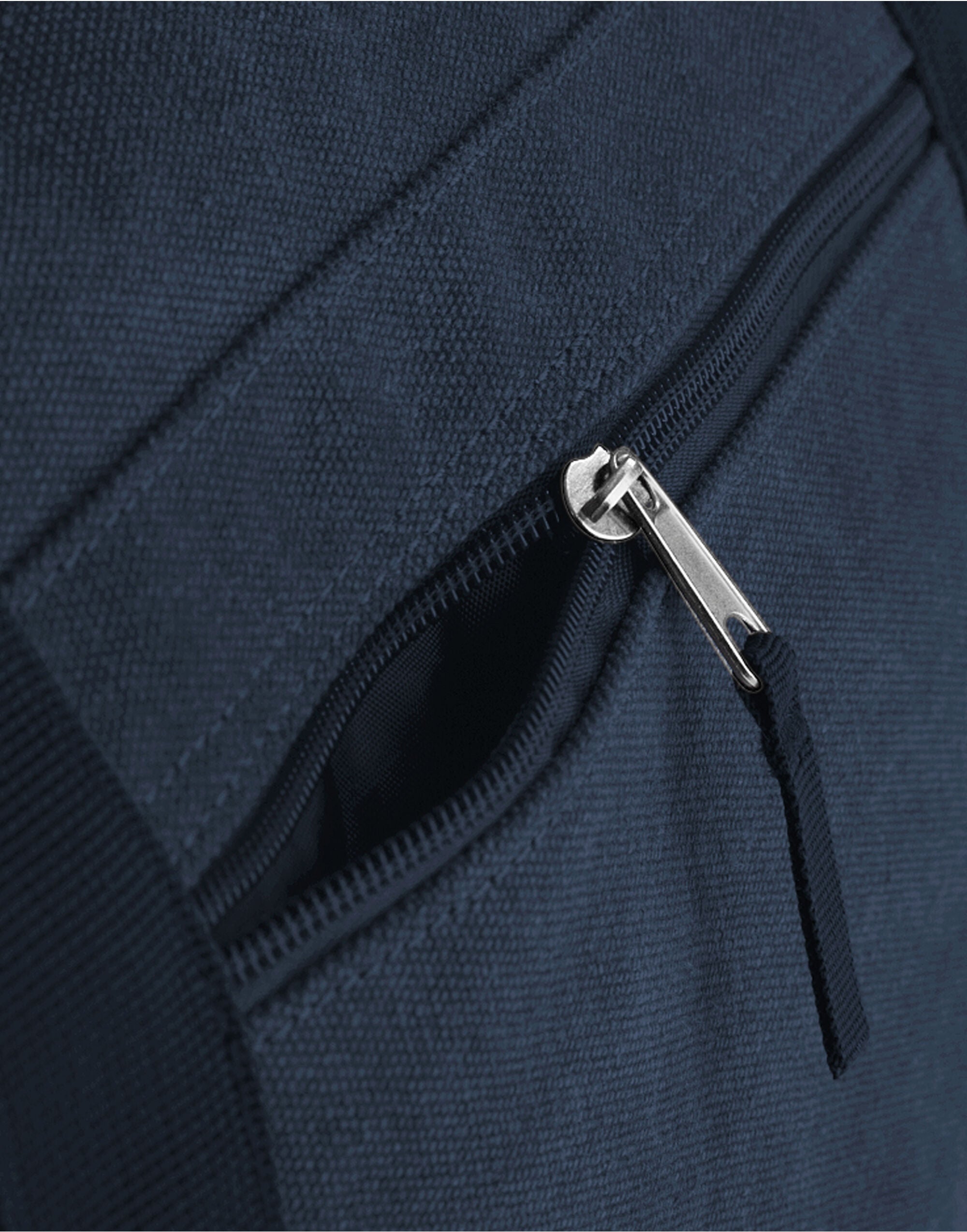 The navy Bagbase Weekender's shoulder strap connection point, showcasing the robust hardware.
