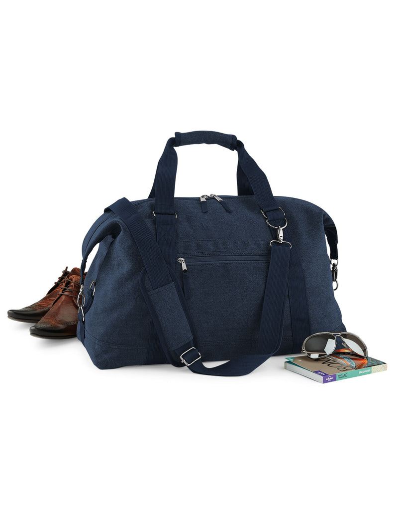 Three-quarter view of the black Bagbase Vintage Canvas Weekender, emphasizing its classic, rugged look.