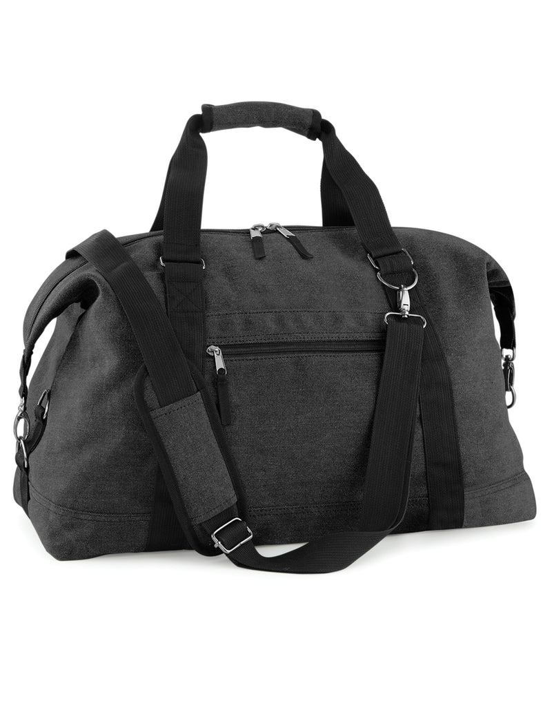 Front view of the Bagbase Vintage Canvas Weekender in black, a large holdall with leather accents.