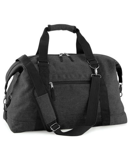 Front view of the Bagbase Vintage Canvas Weekender in black, a large holdall with leather accents.