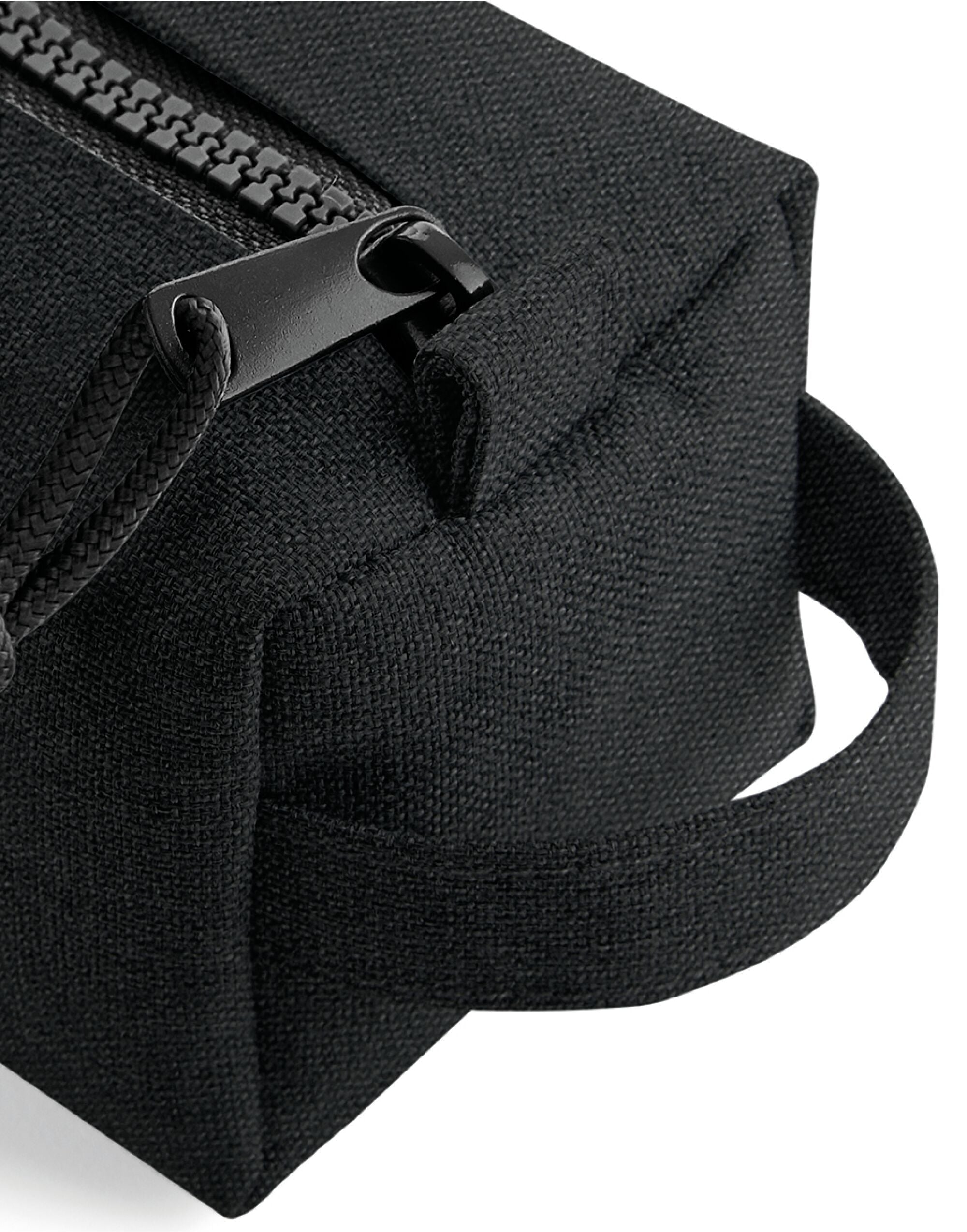 The black Bagbase Essential Pencil Case, shown open to reveal the interior for storing stationery.