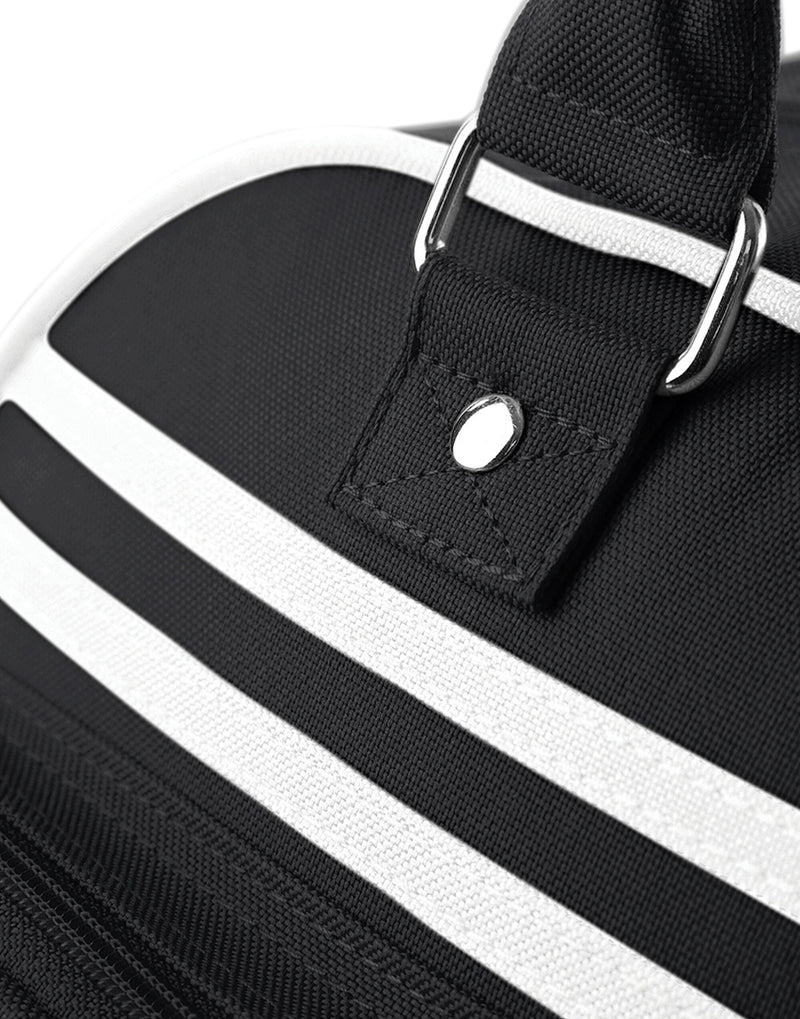 Three-quarter view of the sky blue and white Bagbase Retro Bowling Bag.