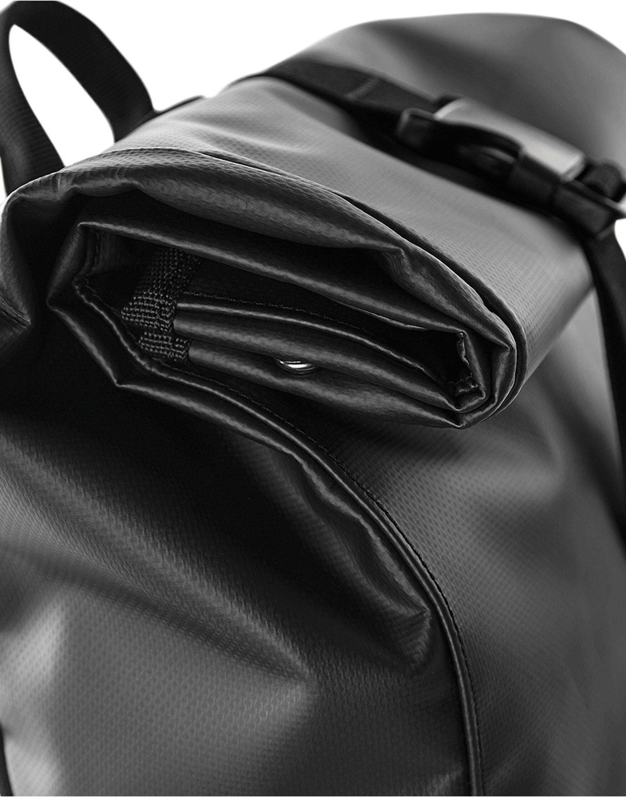 Angled view of the black roll-top backpack.
