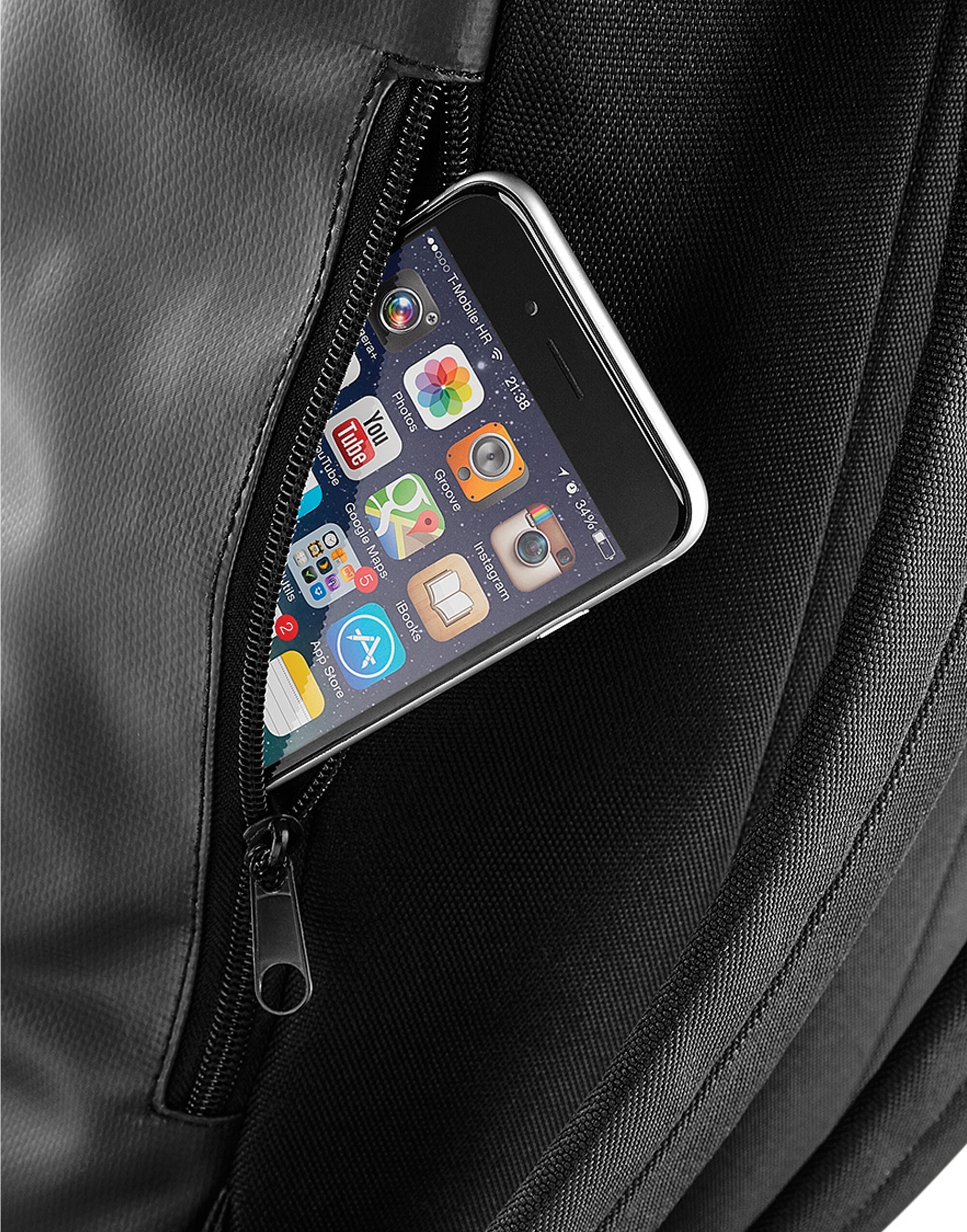 Close-up of the buckle and strap on the black backpack.