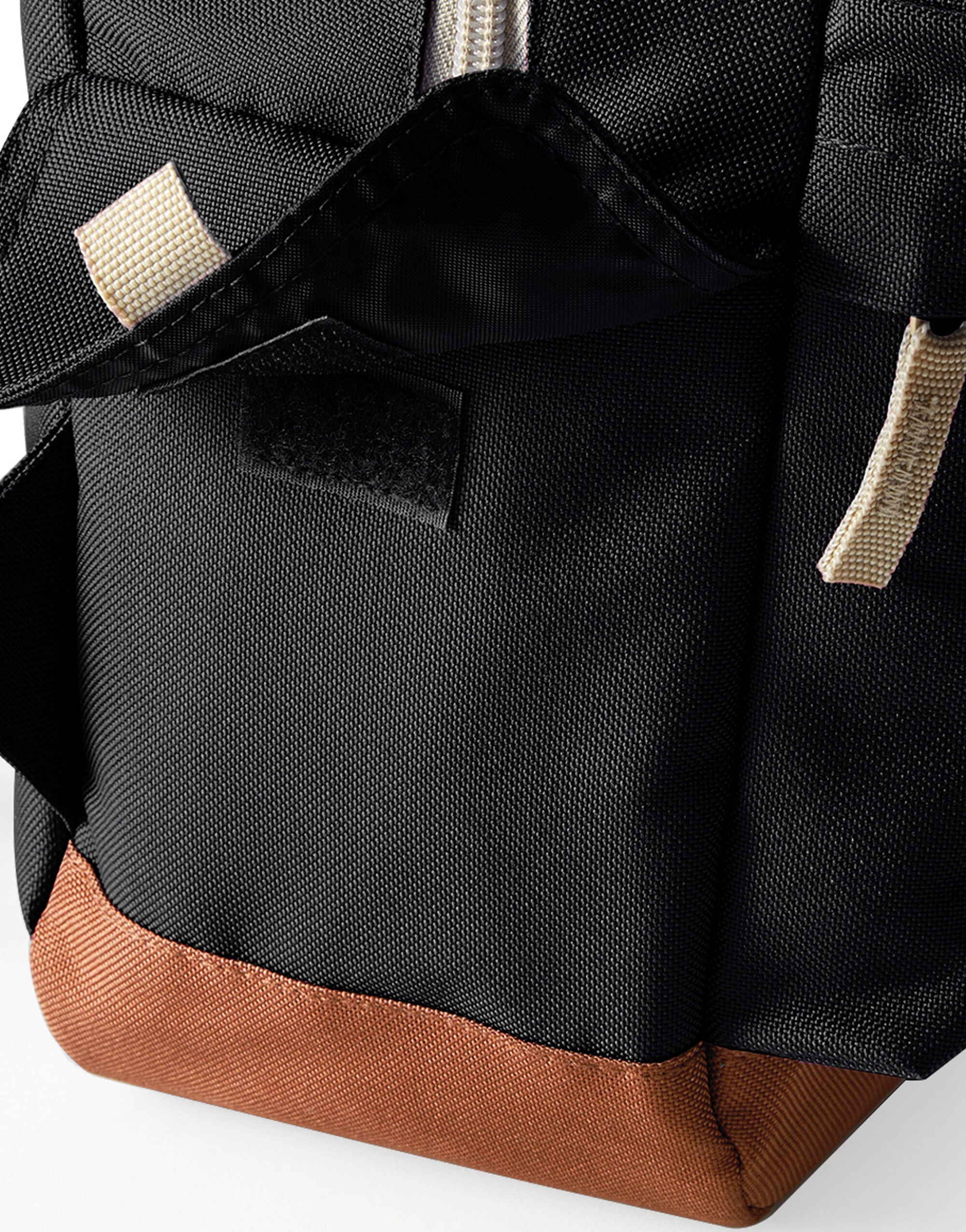 Side view of the black heritage backpack.