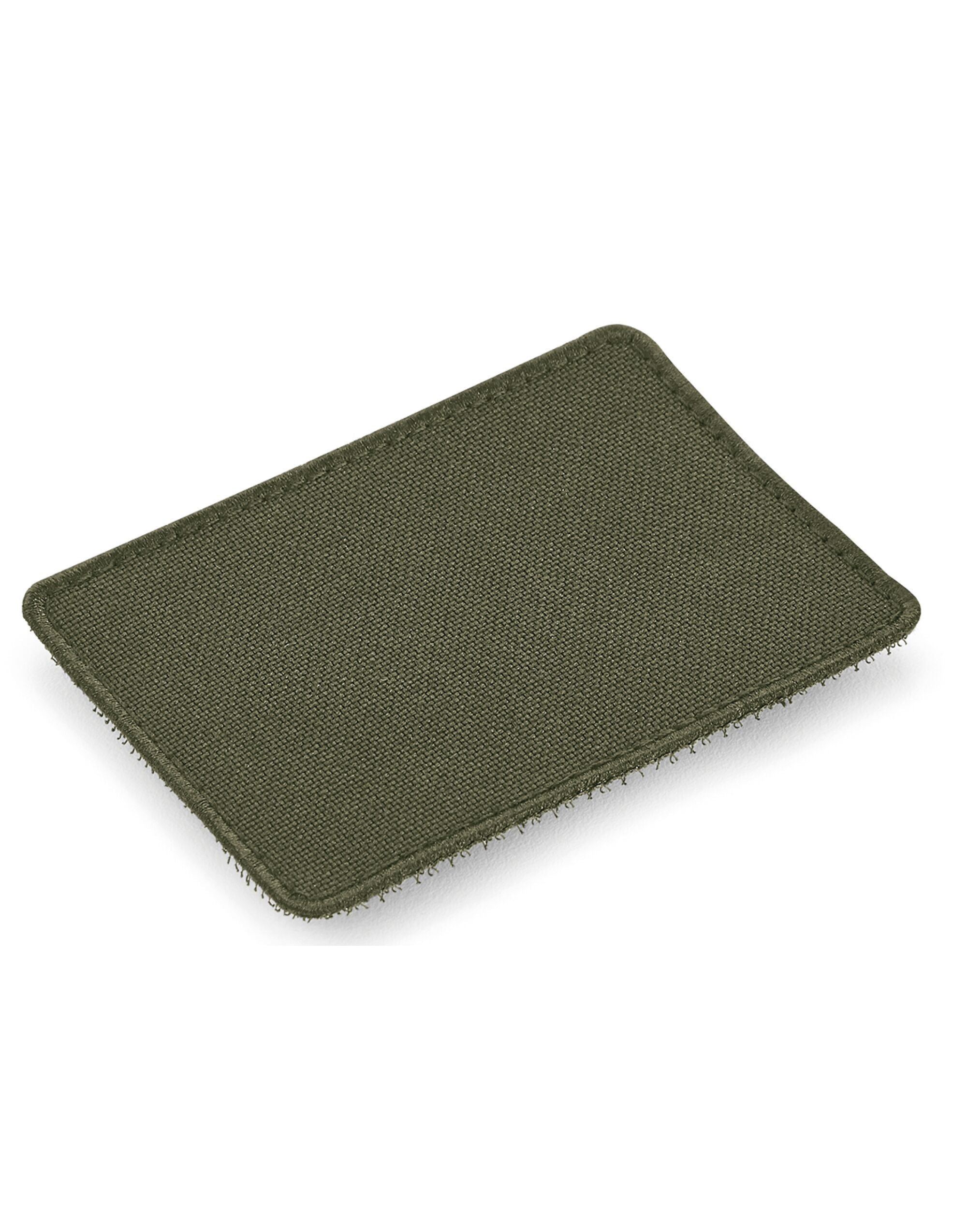 Angled view of the soft green Bagbase boutique waist bag showing its texture.